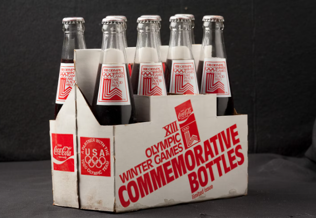 Kemasan Olimpiade Coca-Cola selama berabad-abad